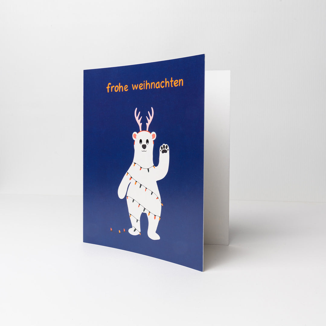 Vorderseite Weihnachskarte mit Eisbär und der Aufschrift Frohe Weihnachten als Ergänzung zu Weihnachtsgeschenk an Kinder